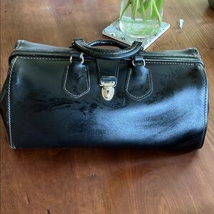 Black Duffel Bag with Structured Design and Metal Clasp